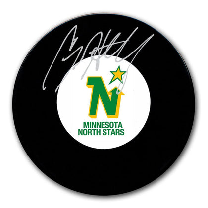 Craig Hartsburg Minnesota North Stars signed hockey puck, featuring his autograph—essential memorabilia for dedicated hockey fans.