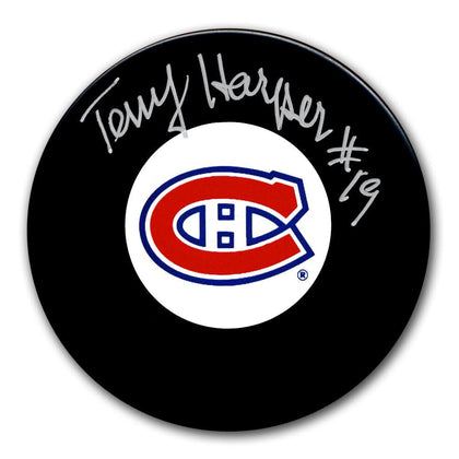 Terry Harper Montreal Canadiens signed black hockey puck featuring a visible autograph—premium memorabilia for collectors.