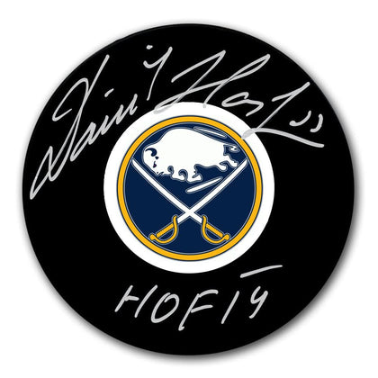 Dominik Hasek Buffalo Sabres HOF signed hockey puck—authentic collectible featuring clear autograph on standard black puck.