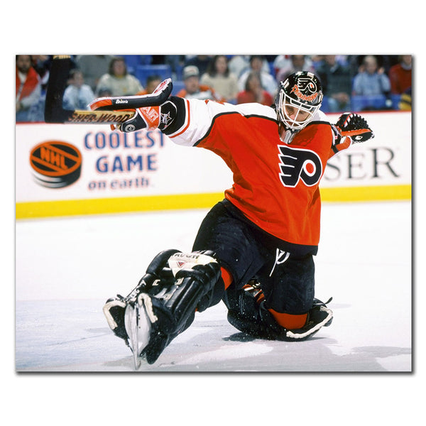 Ron Hextall Philadelphia Flyers 8x10 hockey photo in an orange goalie uniform kneeling and raising his glove for autograph pre-order