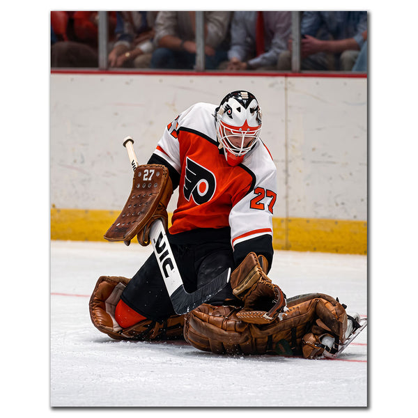 Ron Hextall Philadelphia Flyers 8x10 hockey photo in a white goalie uniform kneeling while making a save for autograph pre-order