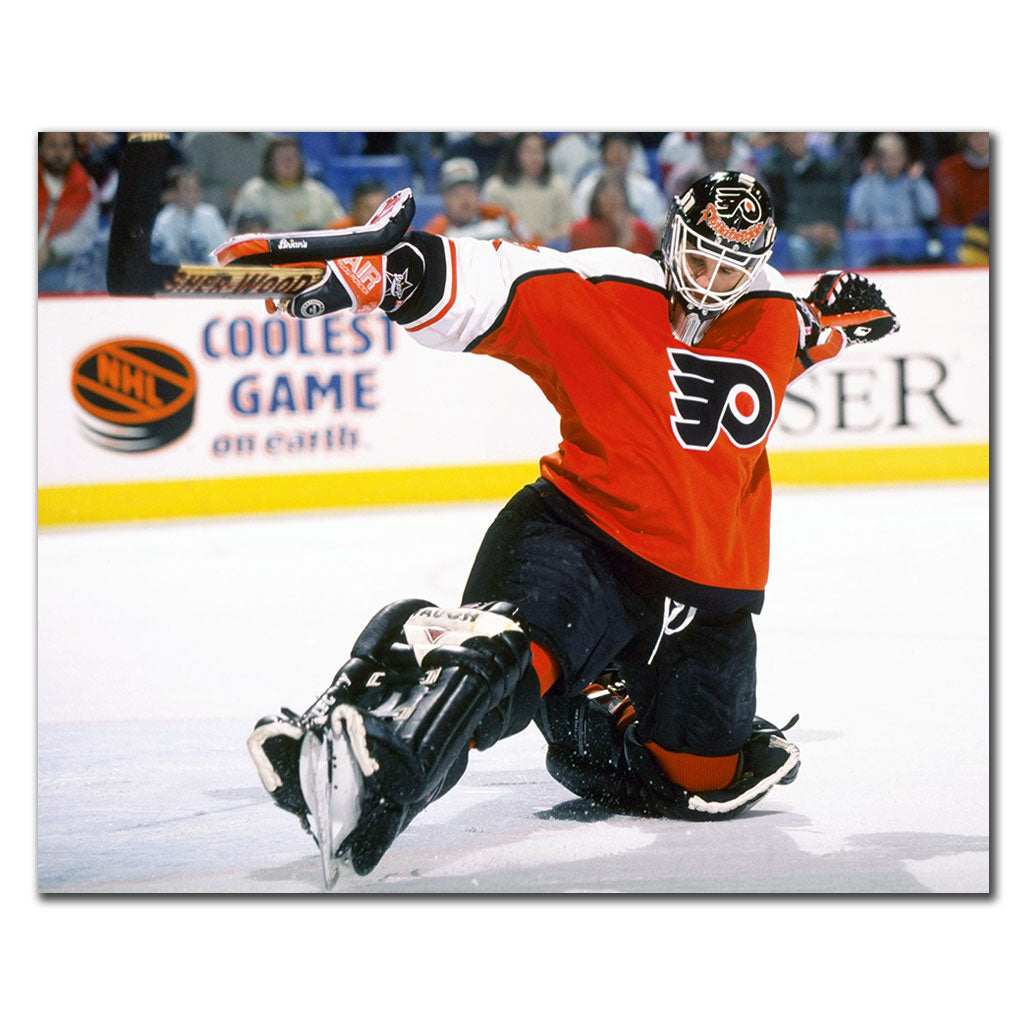 Ron Hextall Philadelphia Flyers 16x20 hockey photo in an orange goalie uniform kneeling and making a save for autograph pre-order