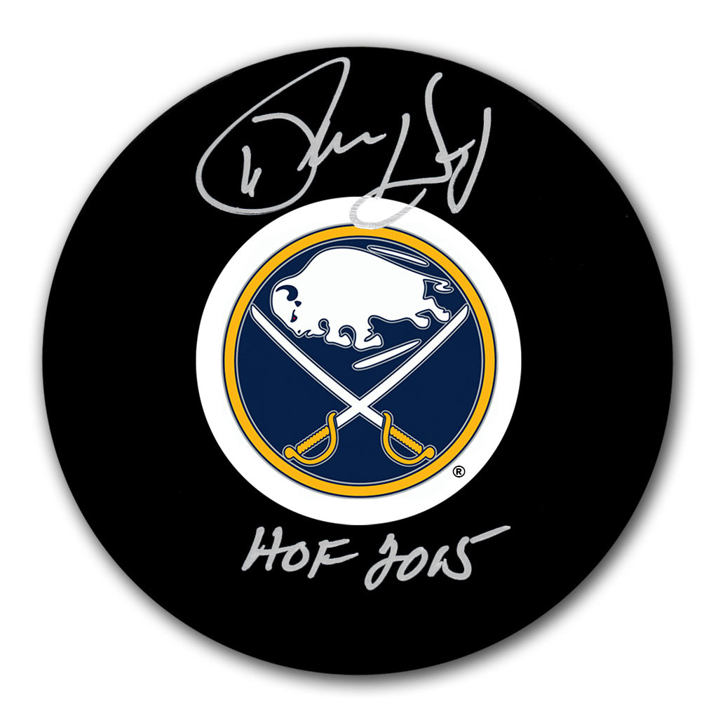 Phil Housley autographed Buffalo Sabres hockey puck with HOF 2015 inscription