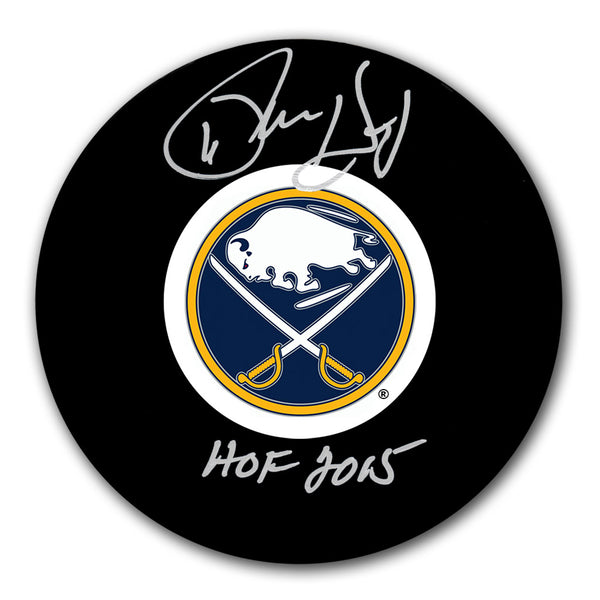 Phil Housley autographed Buffalo Sabres hockey puck with HOF 2015 inscription