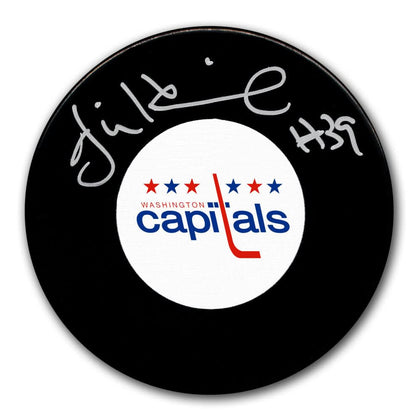 Signed hockey puck featuring Jim Hrivnaks autograph, #39, and Capitals logo; includes Certificate of Authenticity.