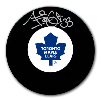 Al Iafrate Toronto Maple Leafs signed hockey puck with #33 and team logo, a collectible autographed item for sports enthusiasts.