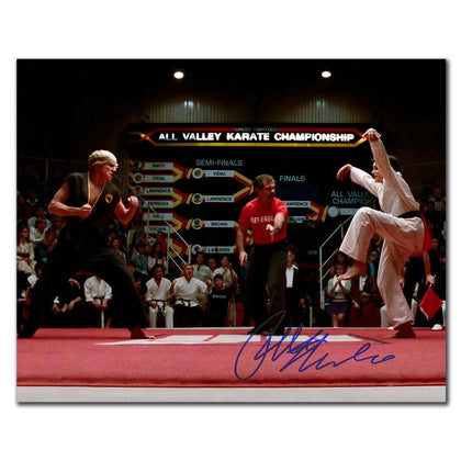 An 11x14 photo signed by Ralph Macchio, featuring two karate competitors facing off in a scene from THE KARATE KID.