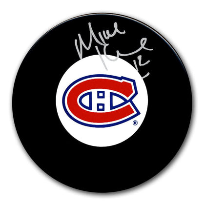 Mike Keane autographed Montreal Canadiens hockey puck with visible signature, includes Certificate of Authenticity; sports memorabilia.