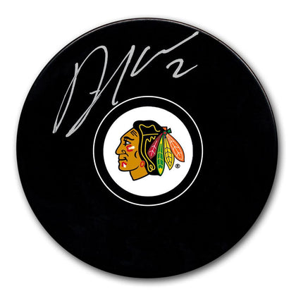 Duncan Keith Chicago Blackhawks signed puck displayed with Certificate of Authenticity, premium autographed memorabilia piece.