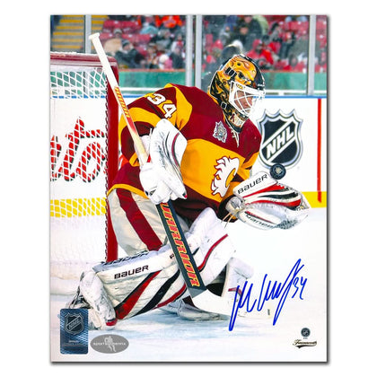 Autographed 8x10 photo of Miikka Kiprusoff in Calgary Flames gear, signed during the 2009 Winter Classic, includes COA.