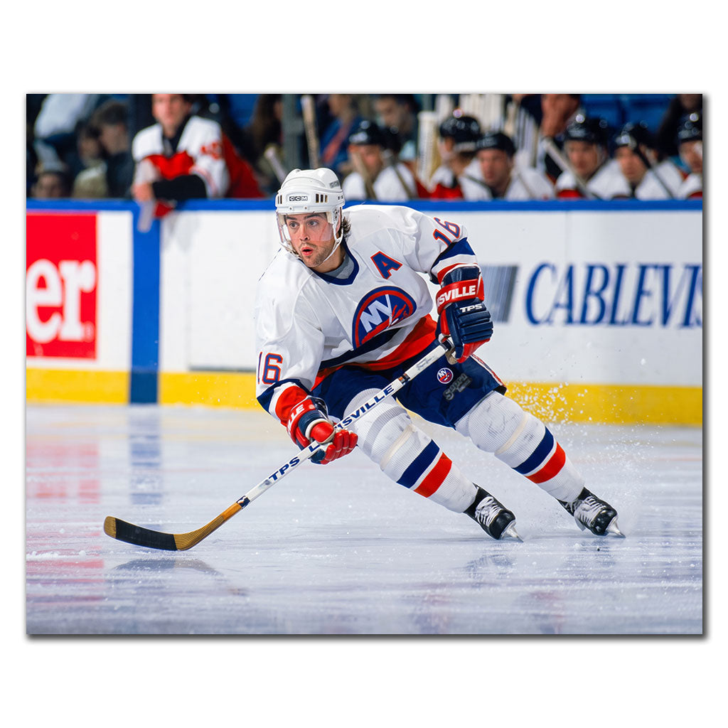 Pat LaFontaine skating in a white New York Islanders uniform