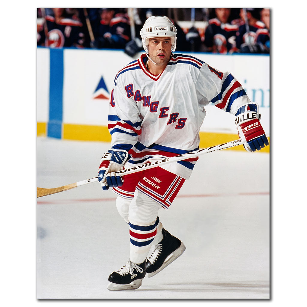 Pat LaFontaine skating in a white New York Rangers uniform