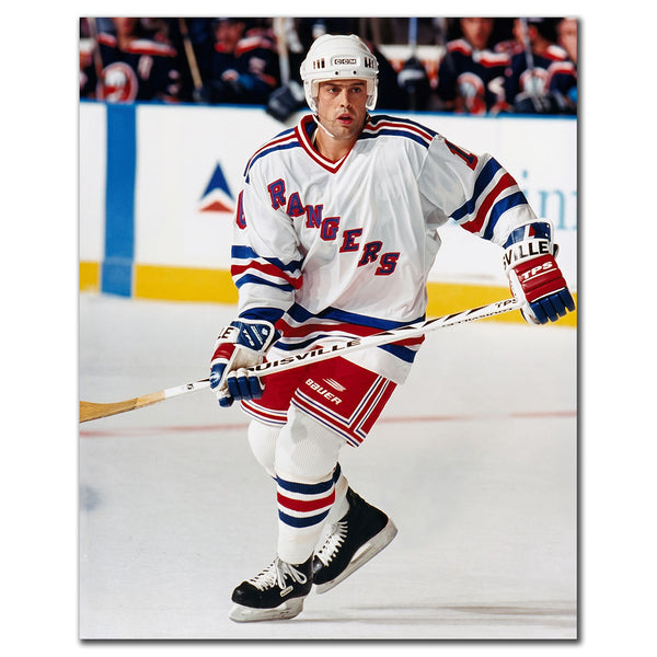 Pat LaFontaine skating in a white New York Rangers uniform