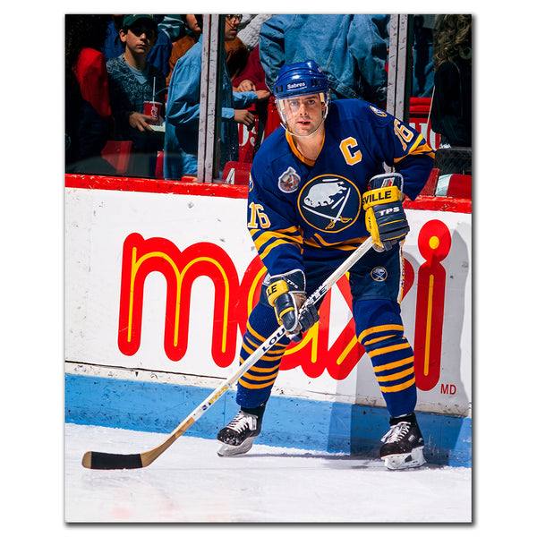 Pat LaFontaine beside the boards in a blue Buffalo Sabres uniform