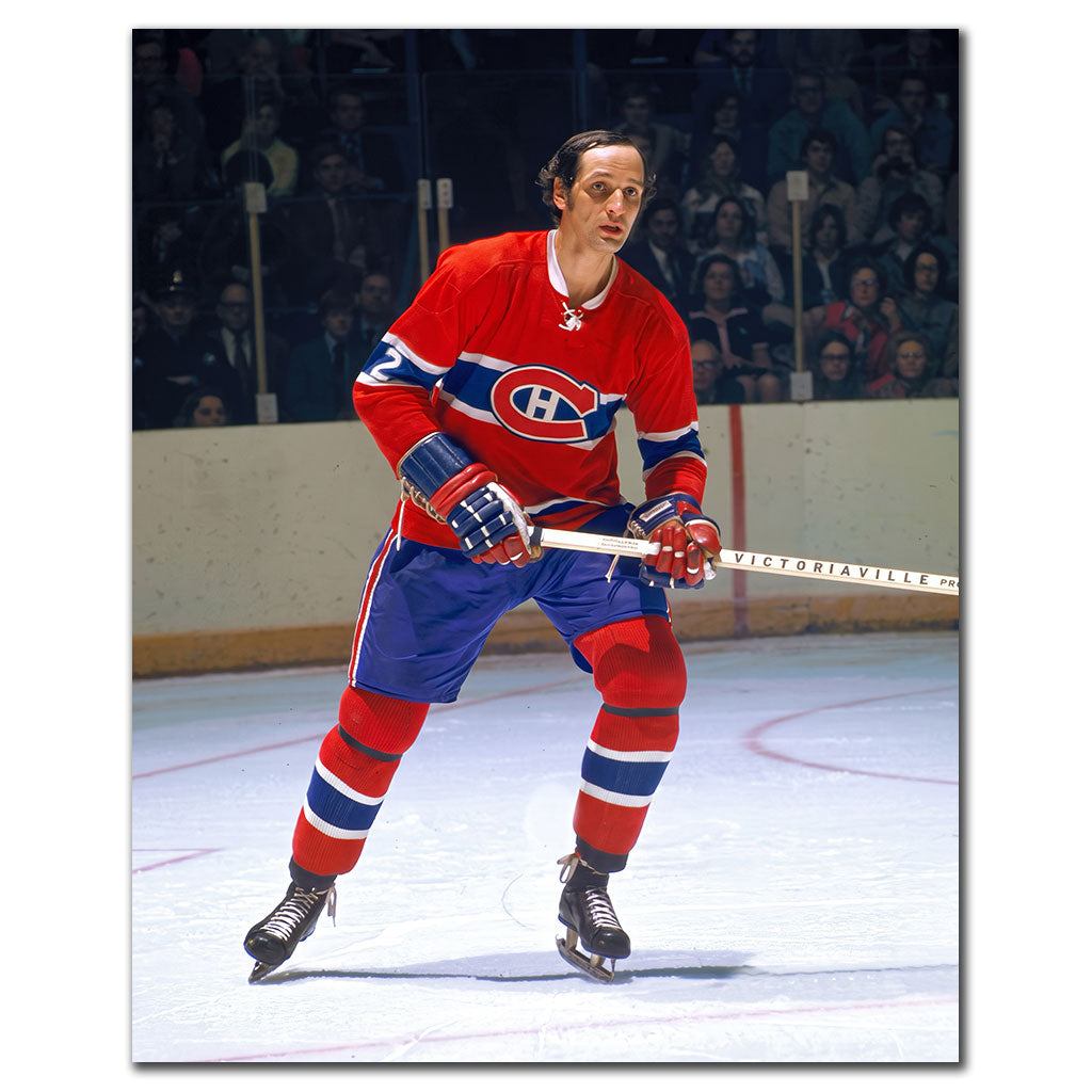 Jacques Laperriere standing on the ice in a red Montreal Canadiens jersey during a vintage NHL game