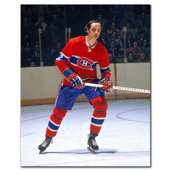 Jacques Laperriere standing on the ice in a red Montreal Canadiens jersey during a vintage NHL game