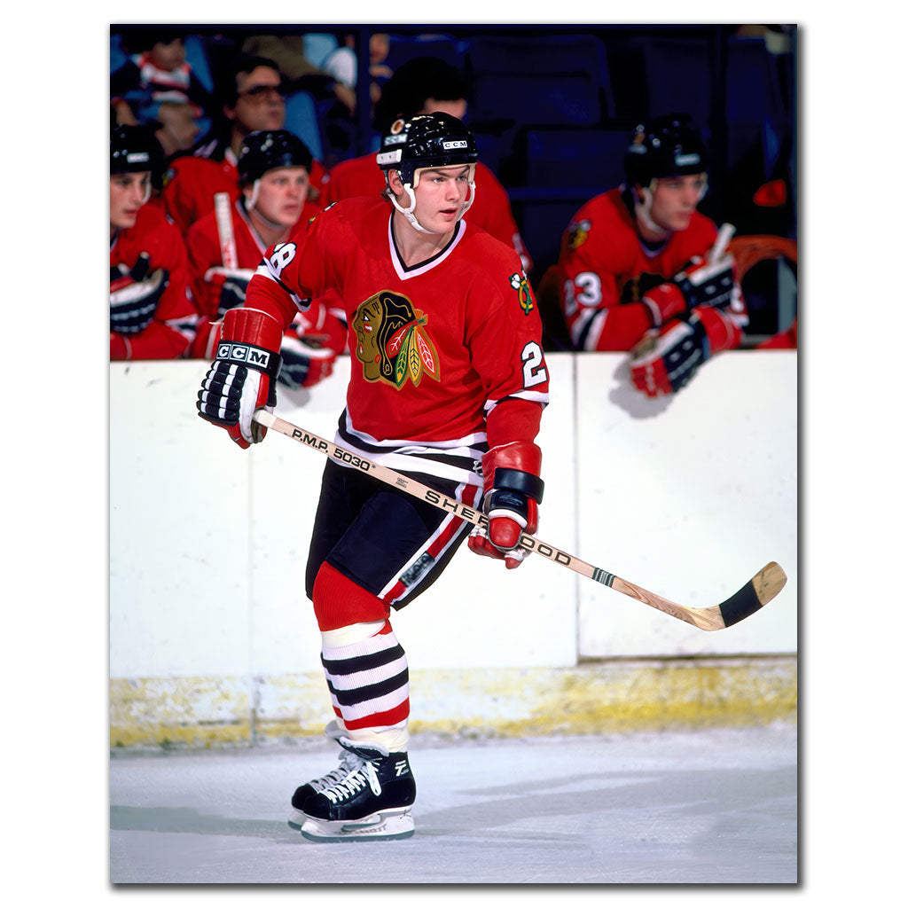 Steve Larmer on the ice in a red Chicago Blackhawks uniform