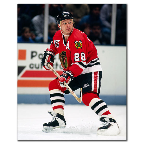 Steve Larmer skating in a red Chicago Blackhawks uniform