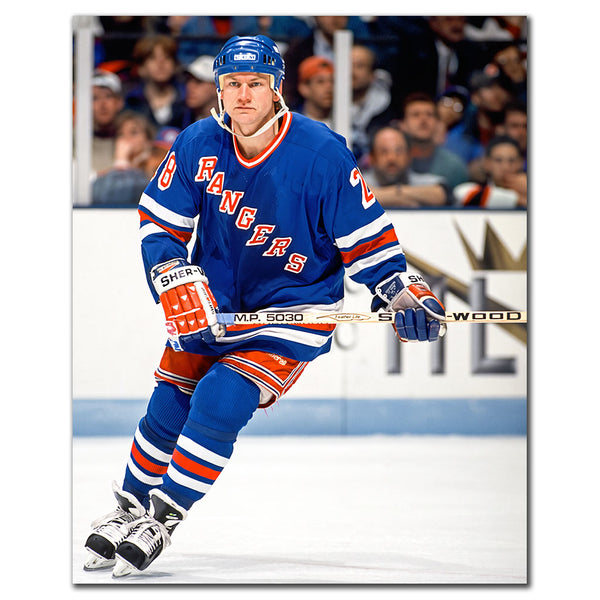 Steve Larmer skating in a blue New York Rangers uniform
