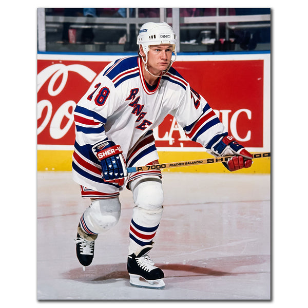Steve Larmer on the ice in a white New York Rangers uniform