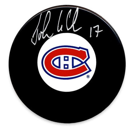 John LeClair Montreal Canadiens autographed black hockey puck featuring a clear signature—a standout collectible for fans.