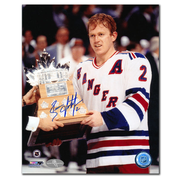 Brian Leetch autographed New York Rangers 8x10 photo holding the 1994 Conn Smythe Trophy