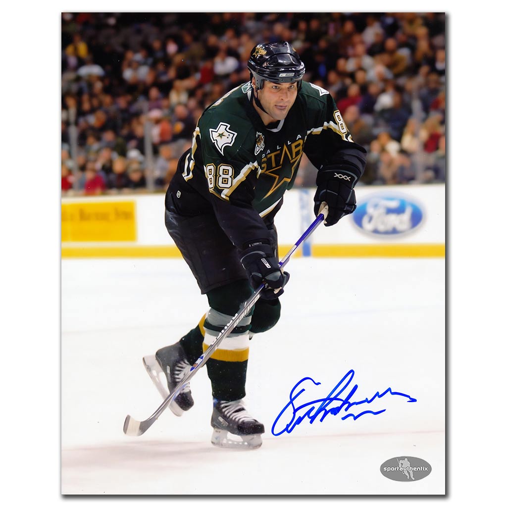 Eric Lindros autographed Dallas Stars 8x10 photo in black jersey on the rush