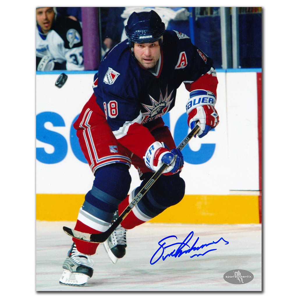 Eric Lindros autographed New York Rangers 8x10 photo in blue jersey during game action