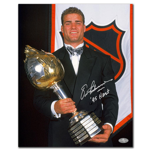 Eric Lindros autographed Philadelphia Flyers 16x20 photo holding the Hart Trophy with 95 Hart inscription