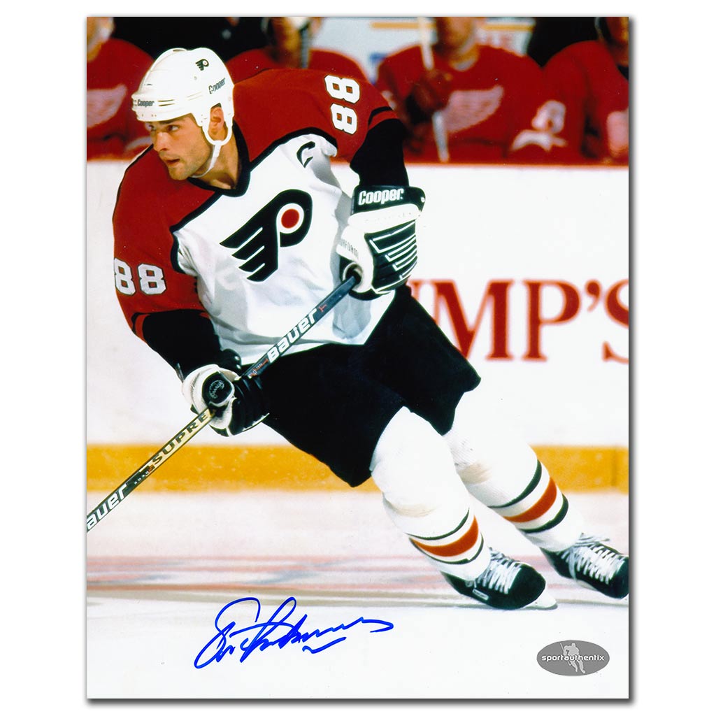 Eric Lindros autographed Philadelphia Flyers 8x10 photo in white jersey skating on the ice