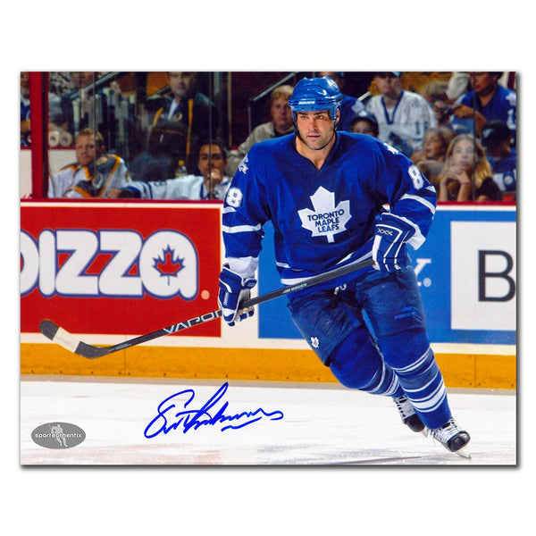Eric Lindros autographed Toronto Maple Leafs 8x10 photo in blue jersey during game action