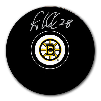 Elias Lindholm autographed Boston Bruins hockey puck, featuring his #28 signature above the team logo on the puck surface.
