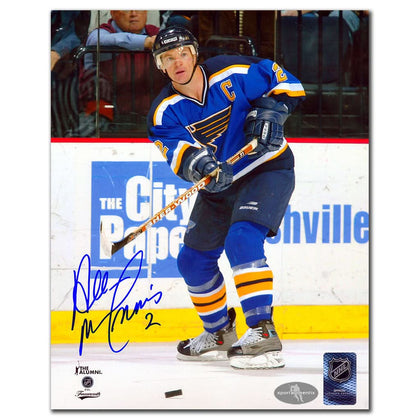 Al MacInnis St. Louis Blues autographed 8x10 photo with COA—signed action shot of him on ice in blue jersey, unframed.