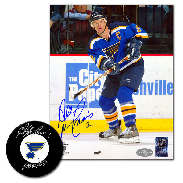 Al MacInnis autographed St. Louis Blues hockey puck and 8x10 photo combo featuring Blues game action and signed team logo puck with HOF 07 inscription