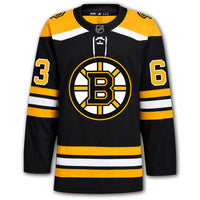 Brad Marchand autographed Boston Bruins Adidas Pro jersey front with black home styling, Bruins crest, NHL shield and number 63 on the sleeves