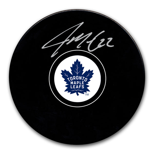 Jake McCabe autographed Toronto Maple Leafs hockey puck with silver signature