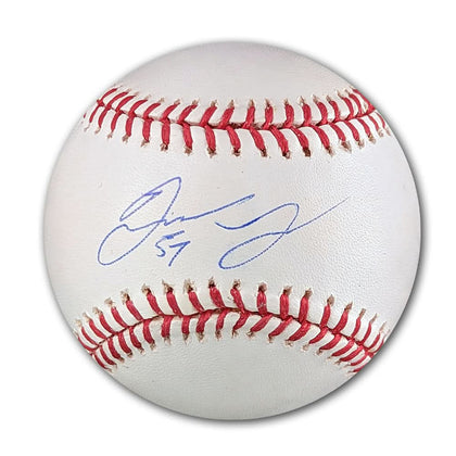 Official MLB baseball featuring red stitching and Seth McClungs blue autograph with #57 inscription directly on the balls surface.