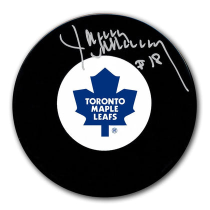 Jim McKenny Toronto Maple Leafs signed hockey puck, featuring his autograph clearly visible on the pucks surface.