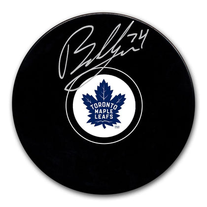 Bobby McMann Toronto Maple Leafs signed hockey puck displaying the official white and blue team logo at the center.