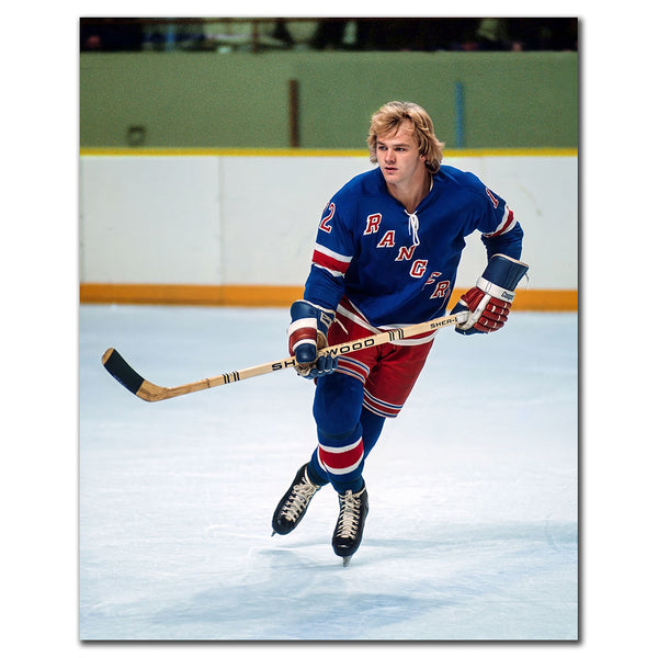 Rick Middleton skating in a blue New York Rangers uniform