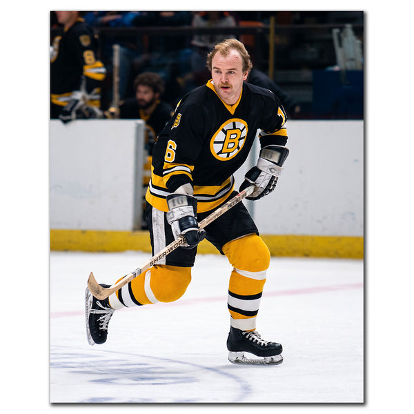 Rick Middleton skating in a black Boston Bruins uniform