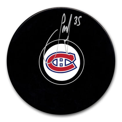 Sam Montembeault autographed Montreal Canadiens hockey puck, black with team logo and silver #35 signature, collectible format.