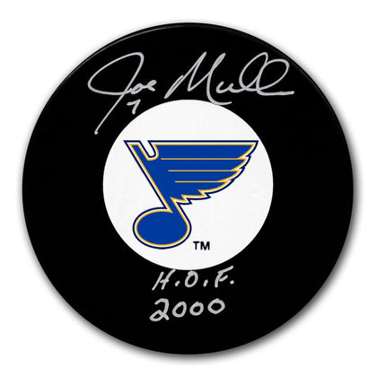 Official St. Louis Blues puck hand-signed by Joe Mullen, featuring team logo and silver H.O.F. 2000 inscription on its surface.