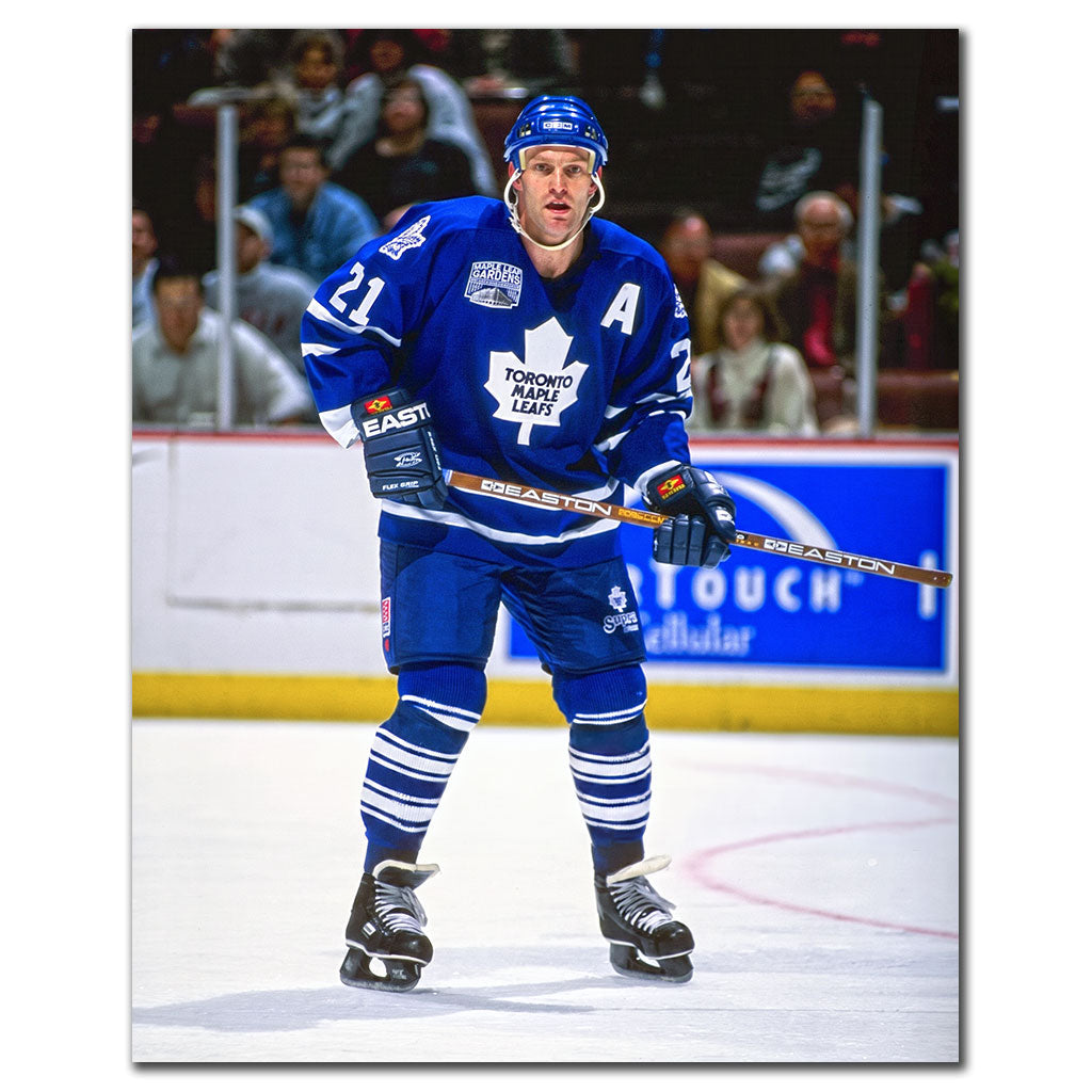 Kirk Muller positioned on the ice in a blue Toronto Maple Leafs uniform