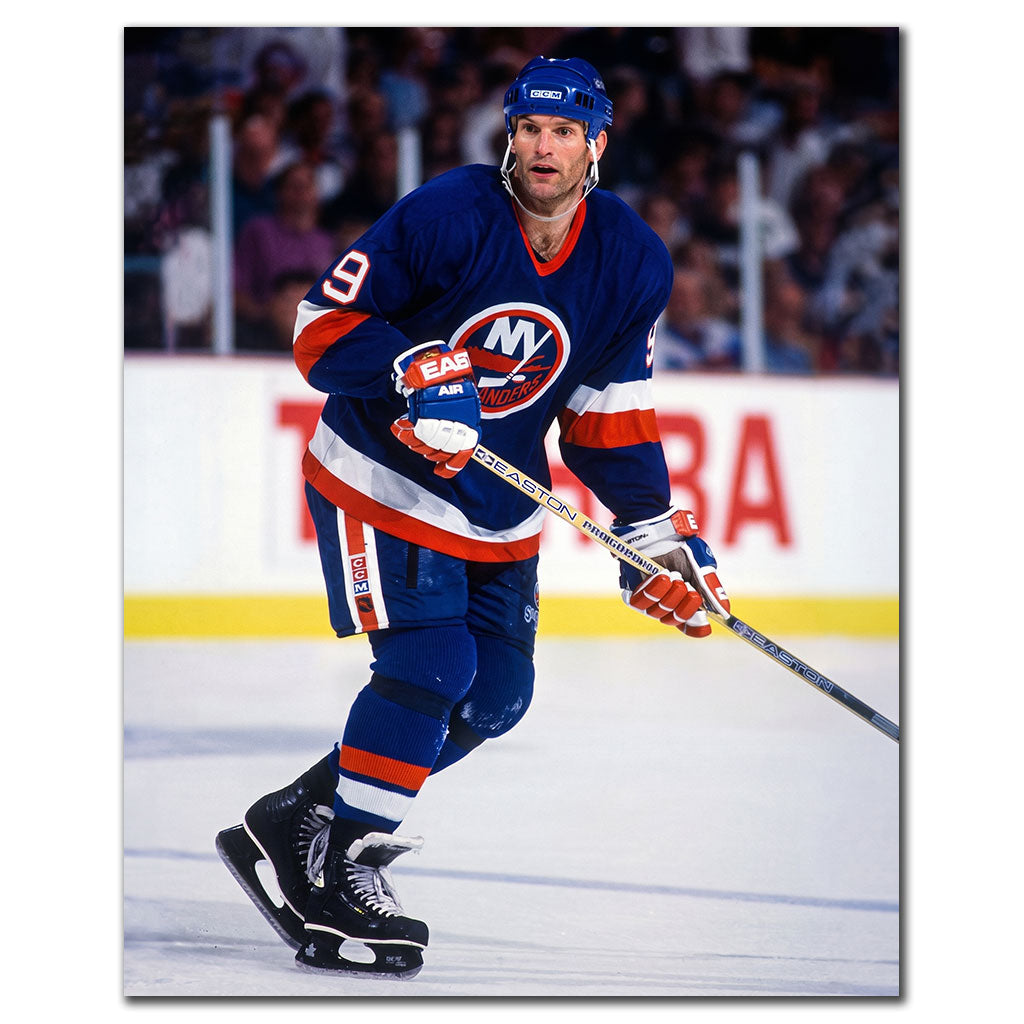 Kirk Muller skating in a blue New York Islanders uniform
