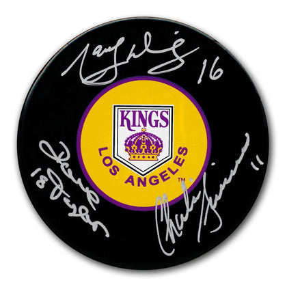 Autographed LA Kings hockey puck signed by Marcel Dionne, Dave Taylor & Charlie Simmer, includes COA—ideal memorabilia for fans.