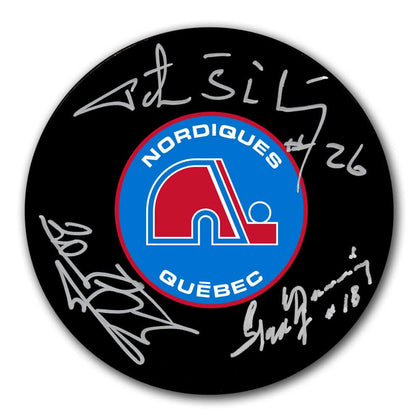 Official Quebec Nordiques hockey puck, hand-signed by Peter, Anton & Marian Stastny—classic collector’s memorabilia.