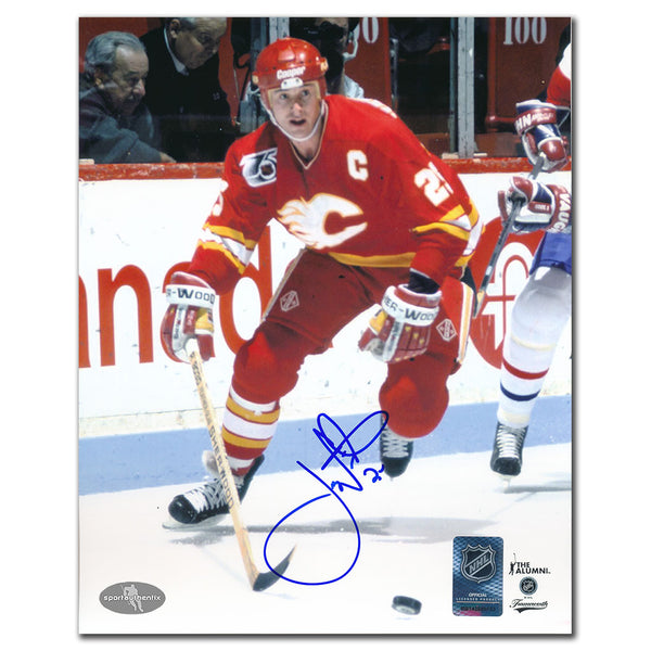 Joe Nieuwendyk autographed Calgary Flames 8x10 photo in red jersey skating with puck
