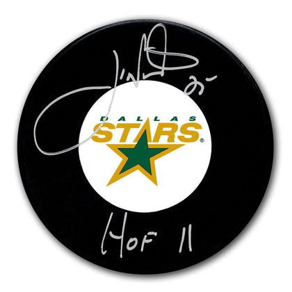 Joe Nieuwendyk Dallas Stars HOF signed hockey puck with silver autograph over the team logo—premium collectible display item.