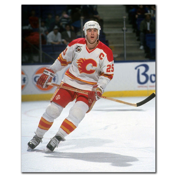 Joe Nieuwendyk in a Calgary Flames white jersey skating during a game